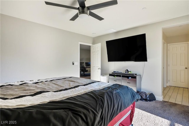 carpeted bedroom featuring ceiling fan