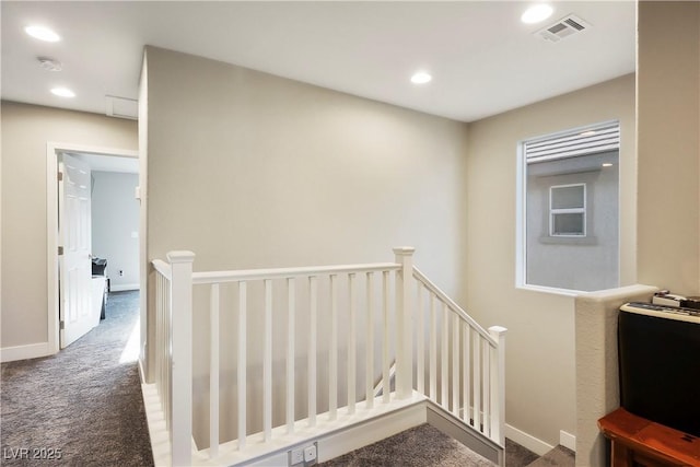 stairway with carpet floors