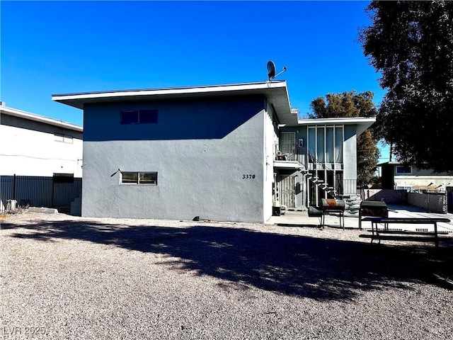 view of side of home featuring a patio area