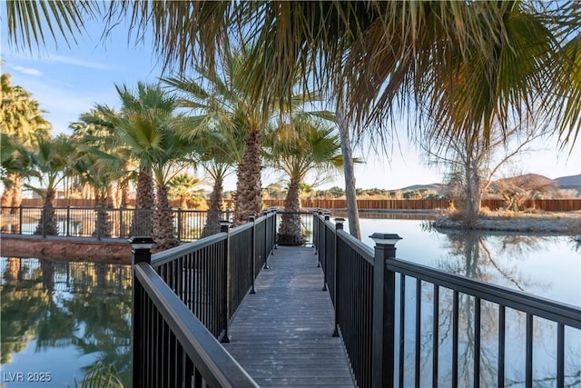 view of dock with a water and mountain view