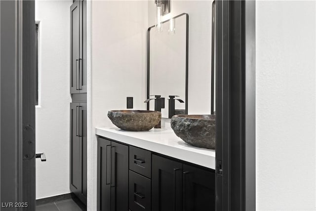 bathroom with vanity and tile patterned flooring