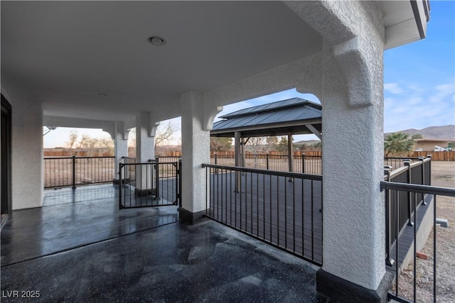 view of patio with a gazebo and a mountain view