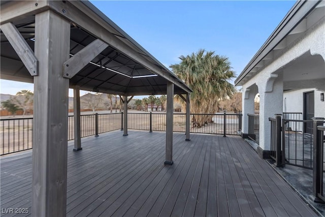 wooden deck featuring a gazebo and a mountain view