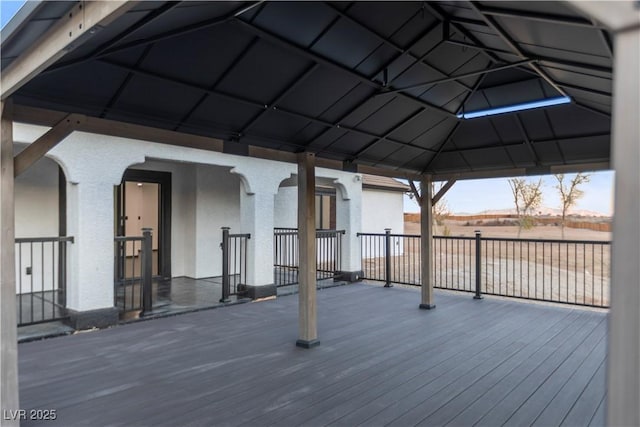 wooden terrace featuring a gazebo