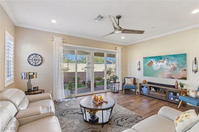 living room featuring ceiling fan, dark hardwood / wood-style flooring, and ornamental molding