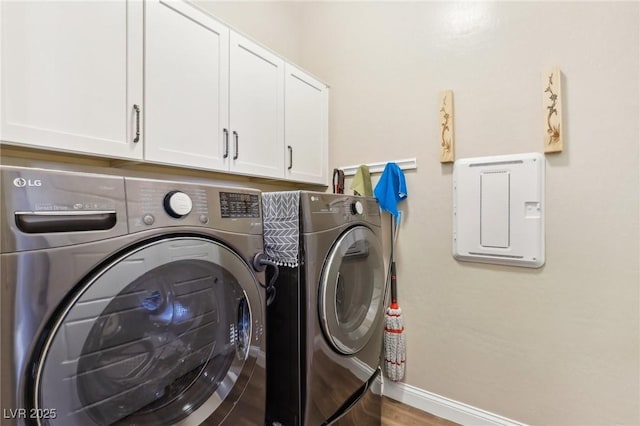 washroom with cabinets and separate washer and dryer