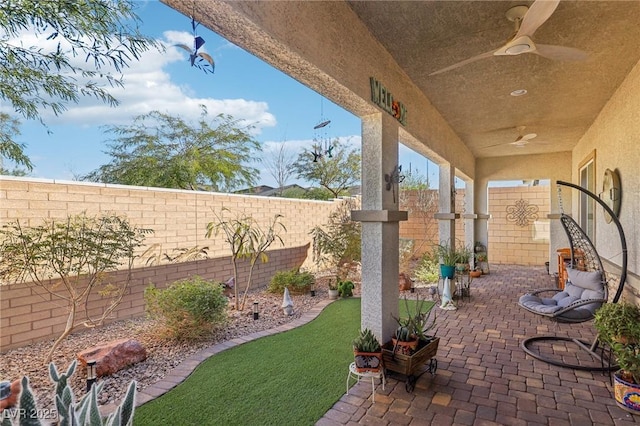 view of patio / terrace featuring ceiling fan