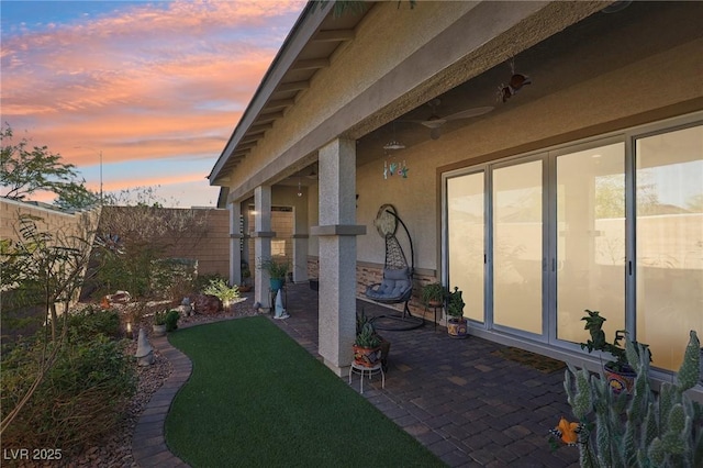 view of patio terrace at dusk