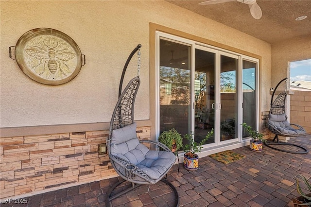 view of patio with ceiling fan