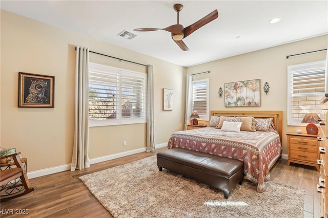 bedroom with ceiling fan and wood-type flooring