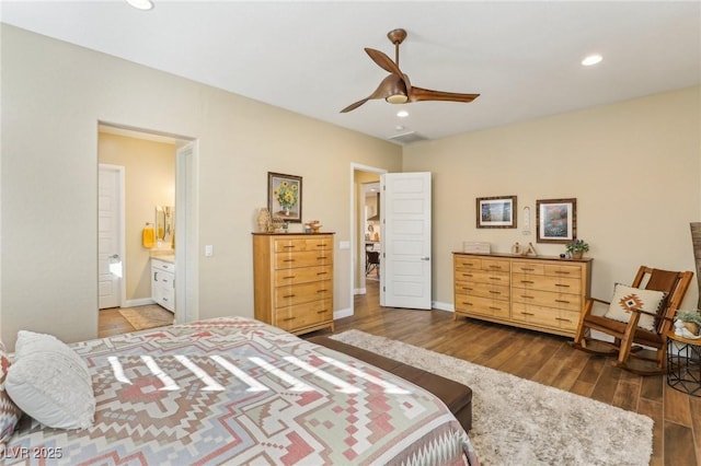 bedroom with ceiling fan, dark hardwood / wood-style floors, and ensuite bath