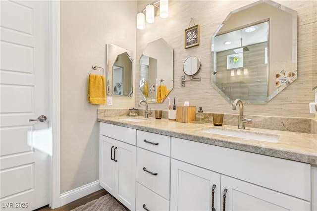 bathroom with a shower and vanity