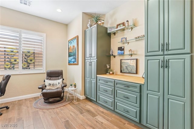 sitting room with light hardwood / wood-style flooring