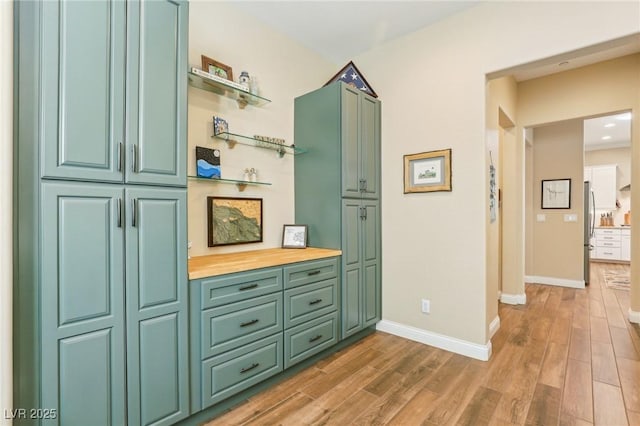 bathroom with hardwood / wood-style floors