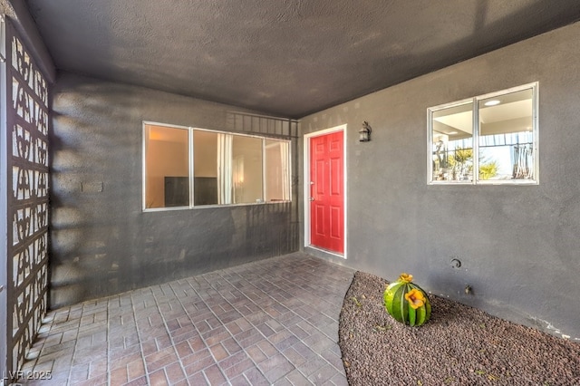 doorway to property featuring a patio