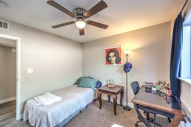 carpeted bedroom with ceiling fan