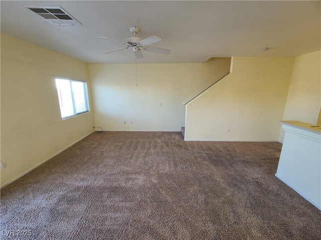 empty room with ceiling fan and carpet