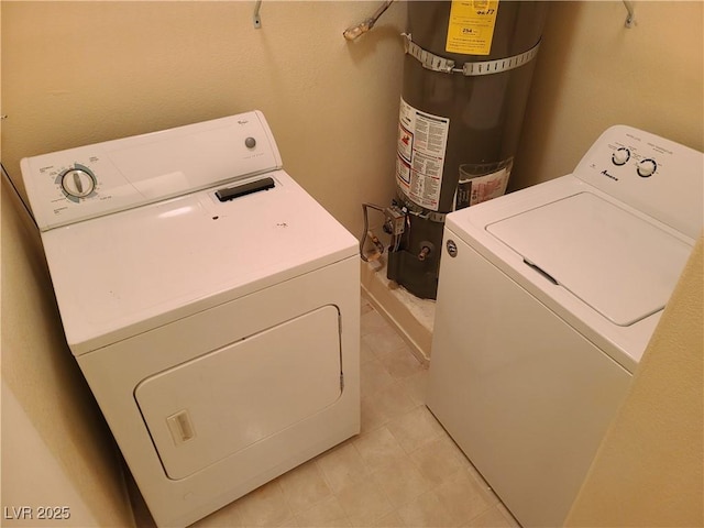 laundry room with separate washer and dryer and strapped water heater