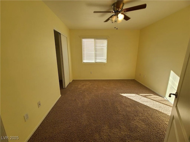 spare room with carpet and ceiling fan