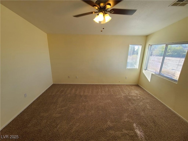 unfurnished room with ceiling fan, carpet, and lofted ceiling