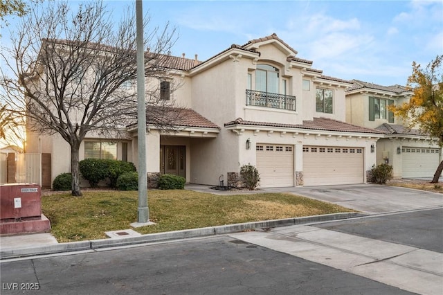 mediterranean / spanish-style home featuring a garage and a front yard