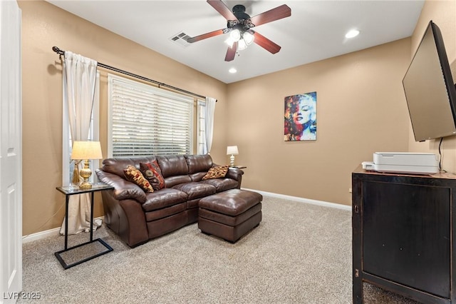 living room with light colored carpet and ceiling fan