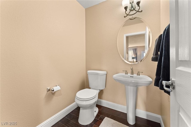 bathroom featuring toilet and sink