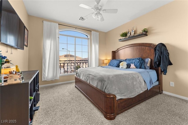 bedroom with ceiling fan and light carpet