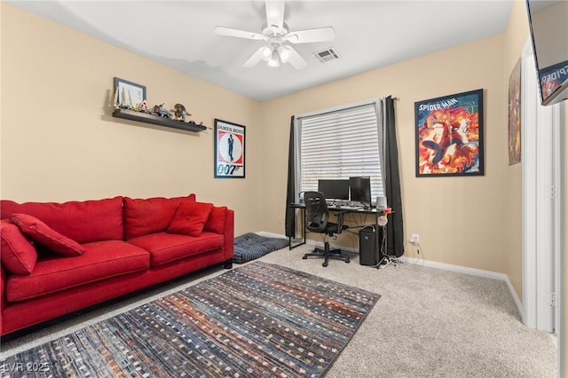 home office featuring ceiling fan and carpet flooring