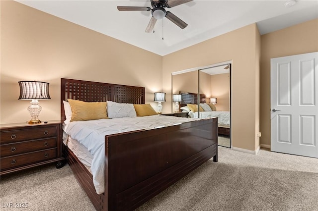 carpeted bedroom featuring ceiling fan and a closet