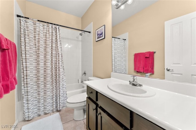 full bathroom featuring tile patterned flooring, vanity, toilet, and shower / bath combo