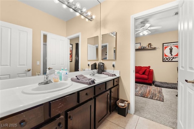 bathroom featuring ceiling fan, tile patterned floors, and vanity