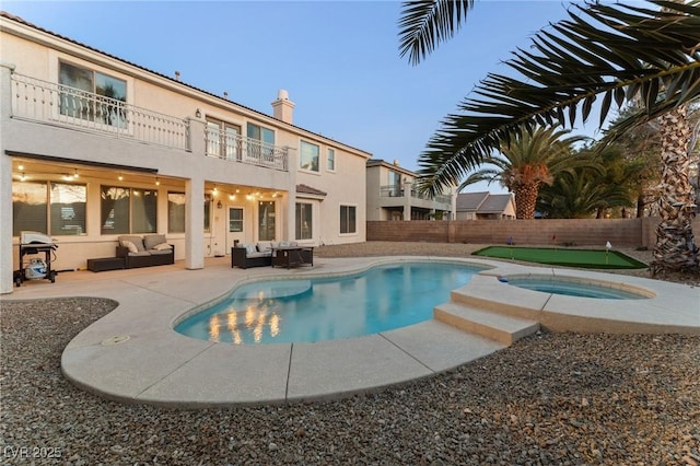 view of pool with an in ground hot tub, an outdoor hangout area, grilling area, and a patio