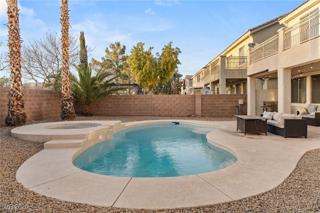 view of swimming pool featuring an in ground hot tub, an outdoor hangout area, and a patio area