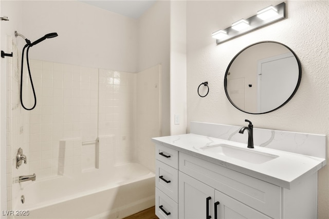 bathroom featuring vanity and shower / tub combination