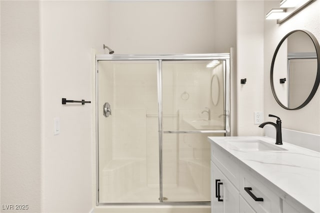 bathroom featuring vanity and walk in shower