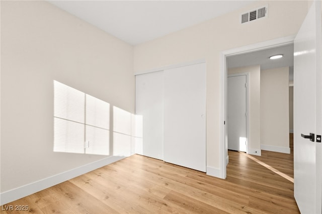 empty room with hardwood / wood-style floors