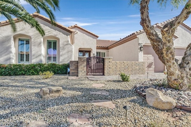 view of front of property featuring a garage