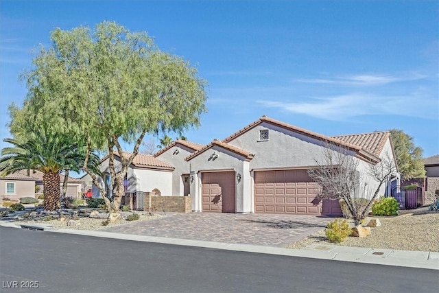 mediterranean / spanish-style house featuring a garage