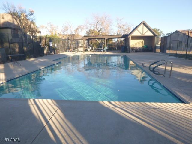 view of pool with a pergola and a patio