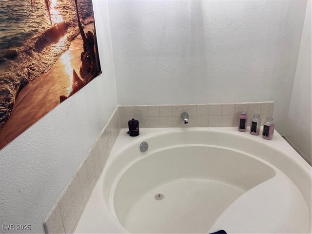 bathroom featuring a tub to relax in