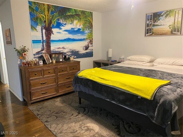 bedroom featuring dark hardwood / wood-style floors