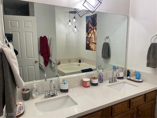 bathroom with vanity and a tub to relax in