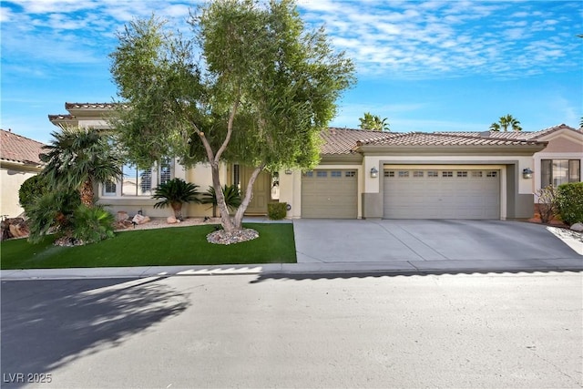 view of front facade with a front lawn and a garage