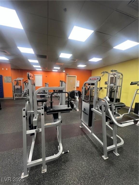 gym featuring a drop ceiling