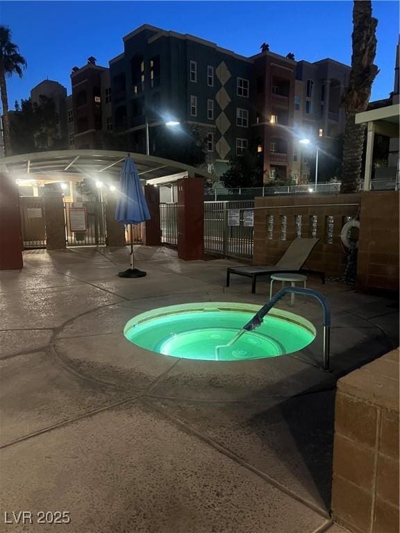 view of swimming pool with a community hot tub and a patio