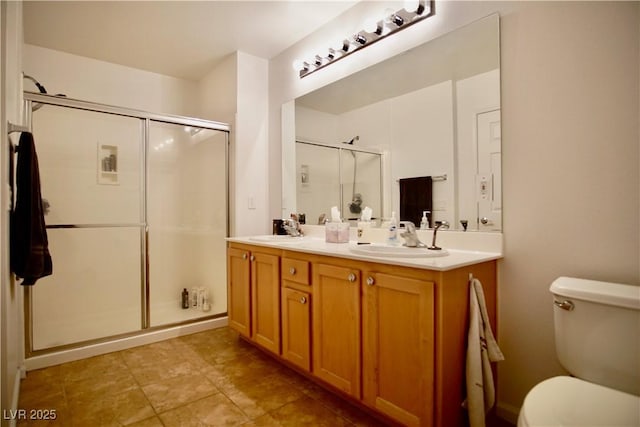 bathroom with vanity, toilet, and walk in shower