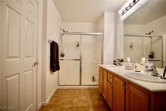 bathroom with vanity and a shower with shower door