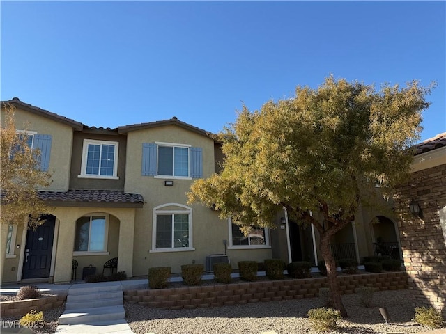 rear view of property featuring cooling unit