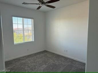 carpeted spare room featuring ceiling fan